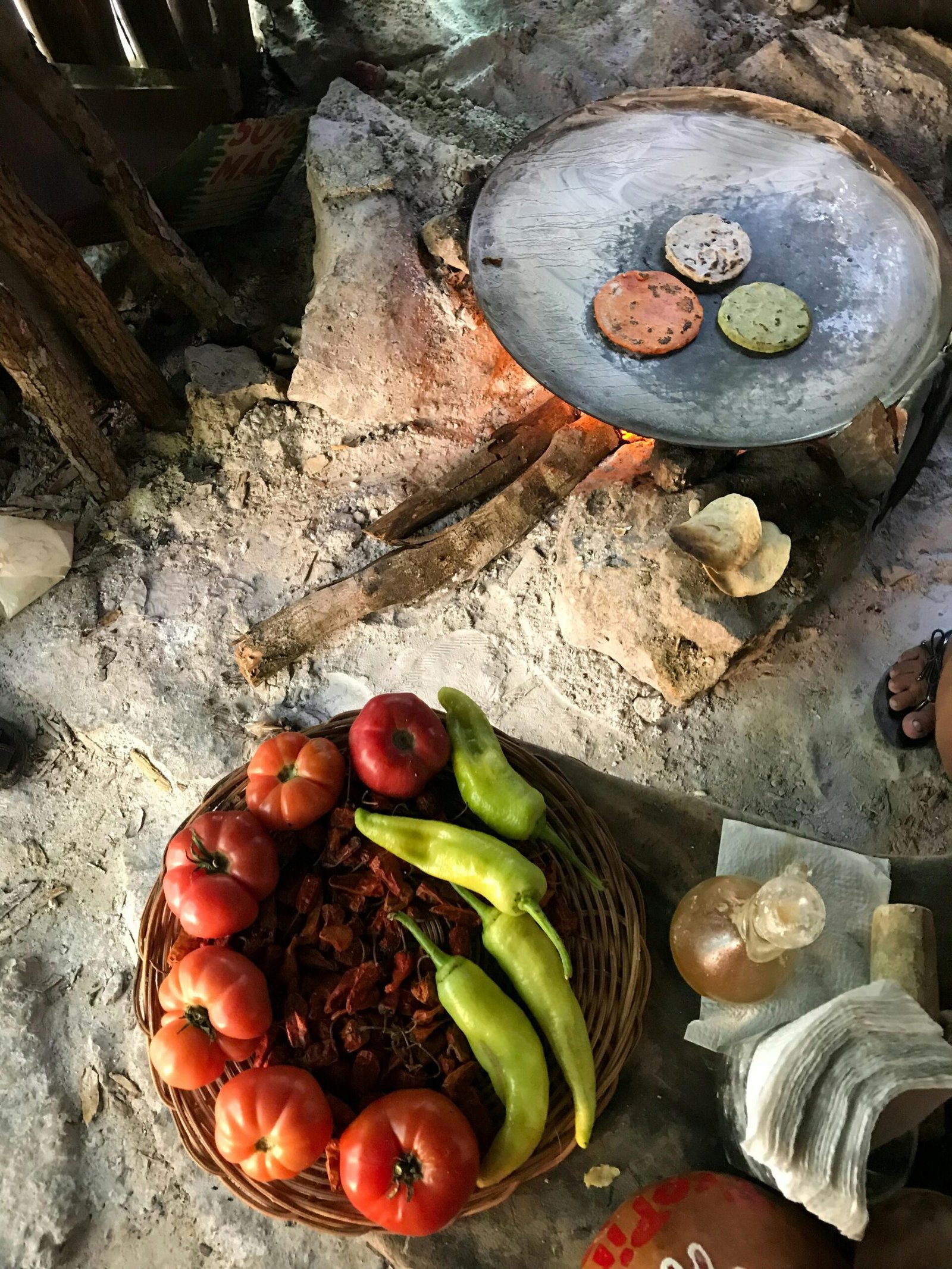 Rustic scene of traditional Mexican cooking with fresh tomatoes and peppers in Valladolid, Mexico.
